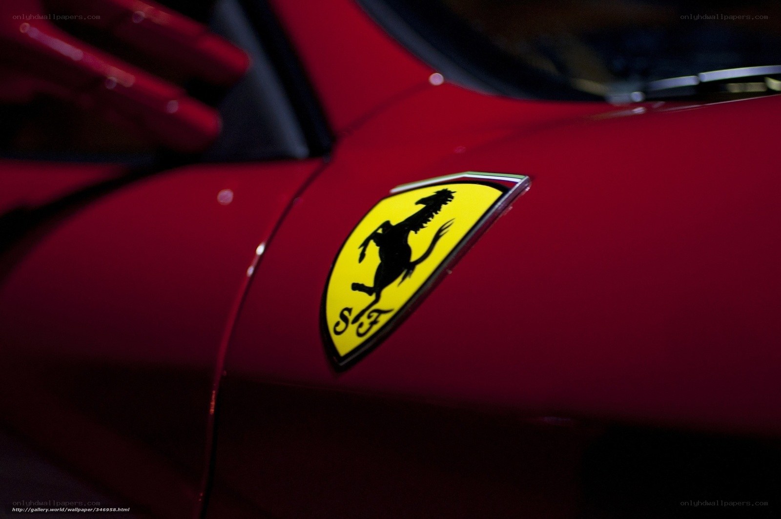 Ferrari emblem on red car