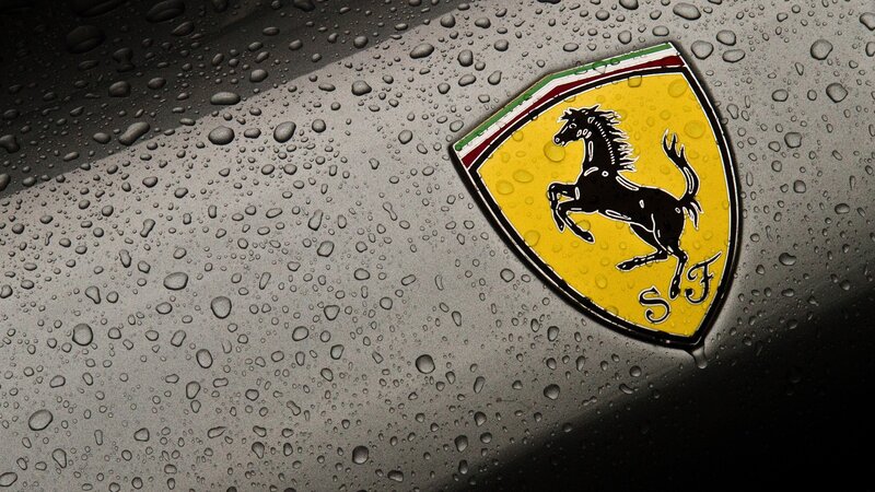 Ferrari emblem on wet surface