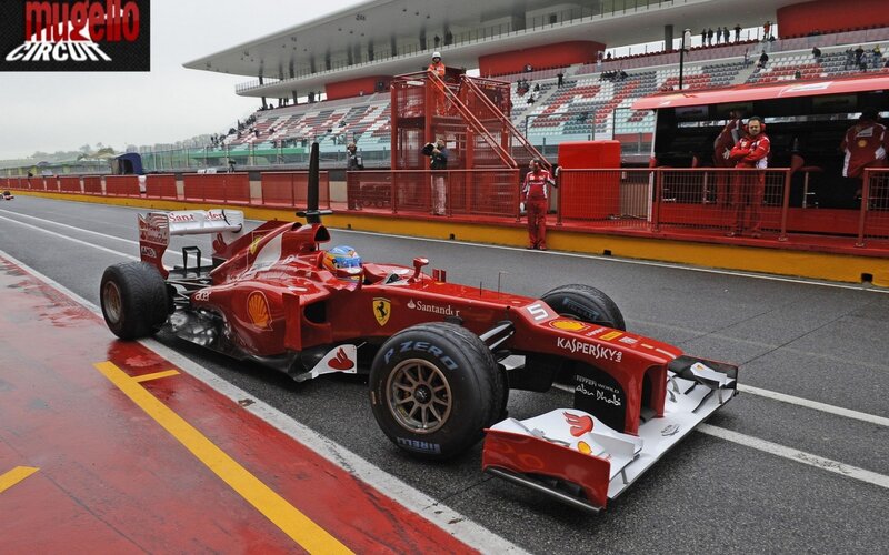 Ferrari F1 car on wet track