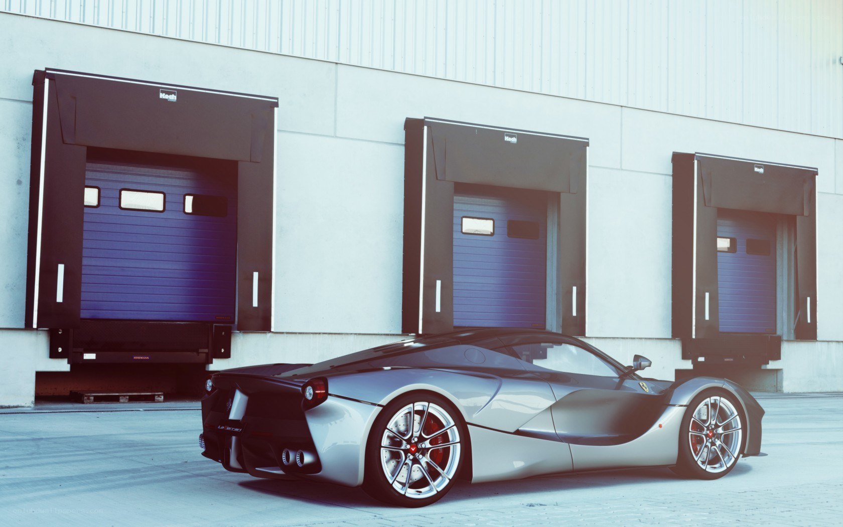 Ferrari LaFerrari in front of warehouse