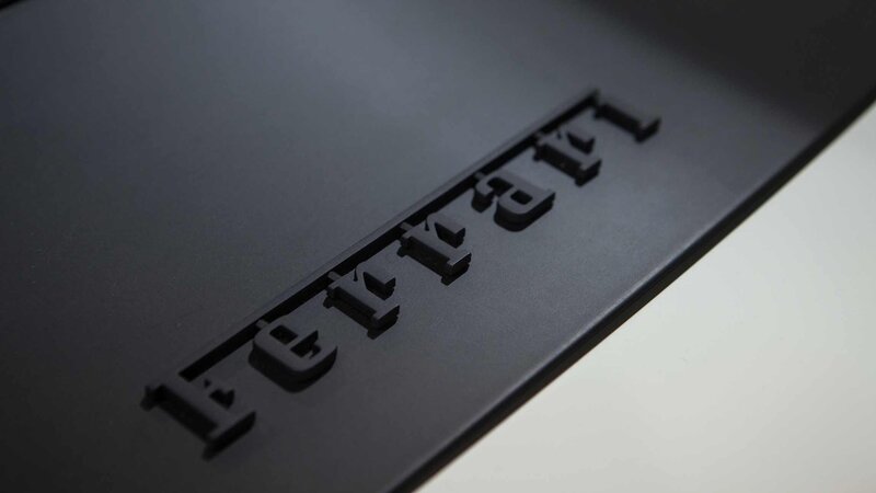 Ferrari logo on black surface
