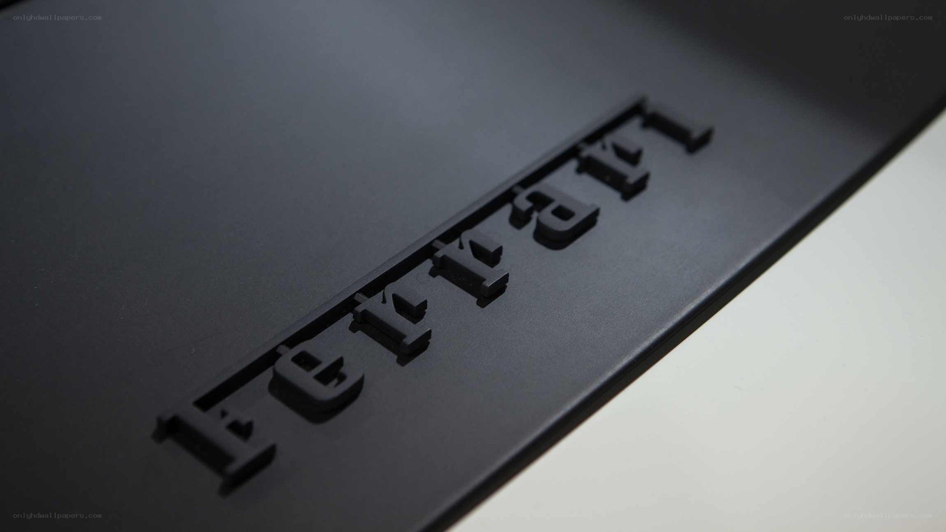 Ferrari logo on black surface