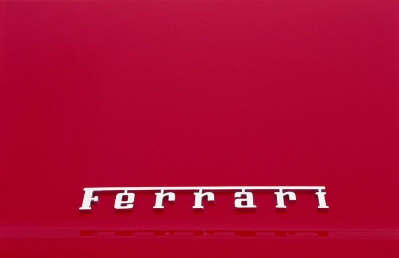 Ferrari logo on red surface