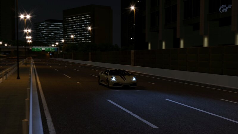 Ferrari on city highway at night