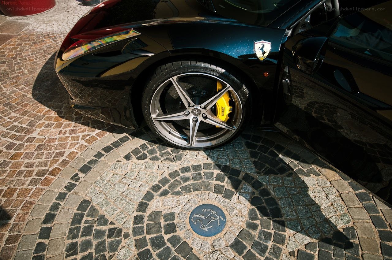 Ferrari on cobblestone pavement