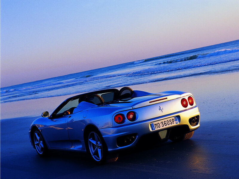 Ferrari on the beach at dusk