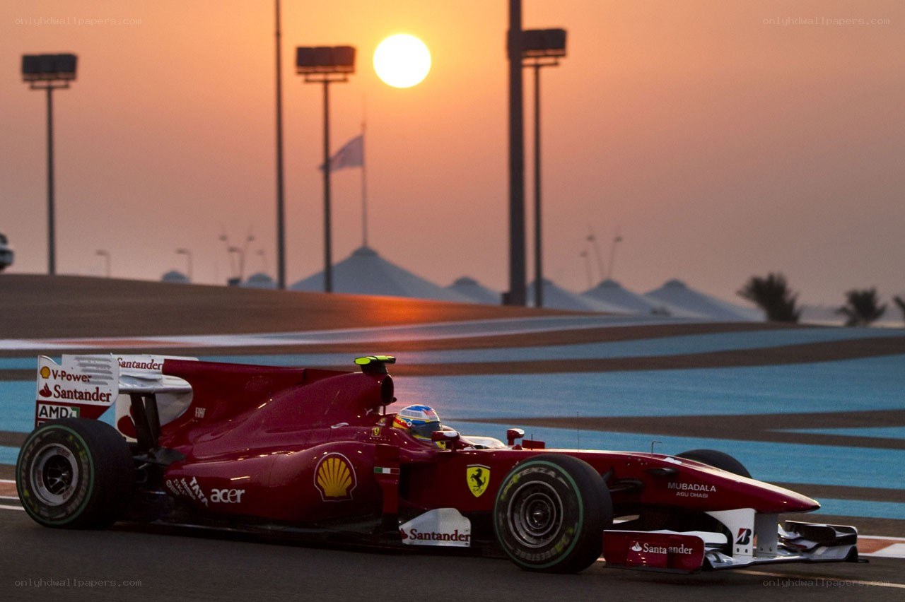 Ferrari on the racetrack at sunset