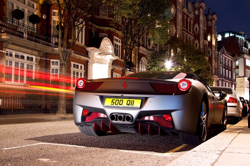 Ferrari parked on city street