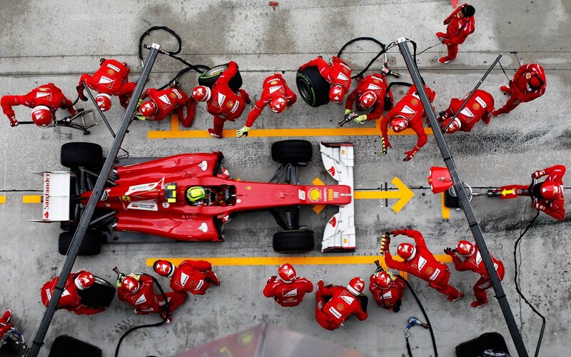 Ferrari Pit Crew — Red, Focused, Photograph