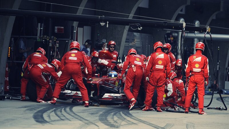 Ferrari Pit Crew — Red, Focused