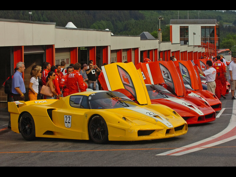 Ferrari race cars in pit lane