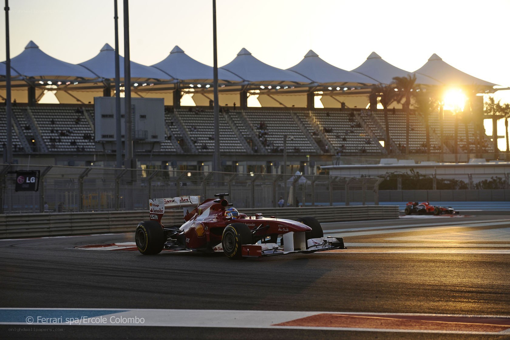 Ferrari racing at sunset