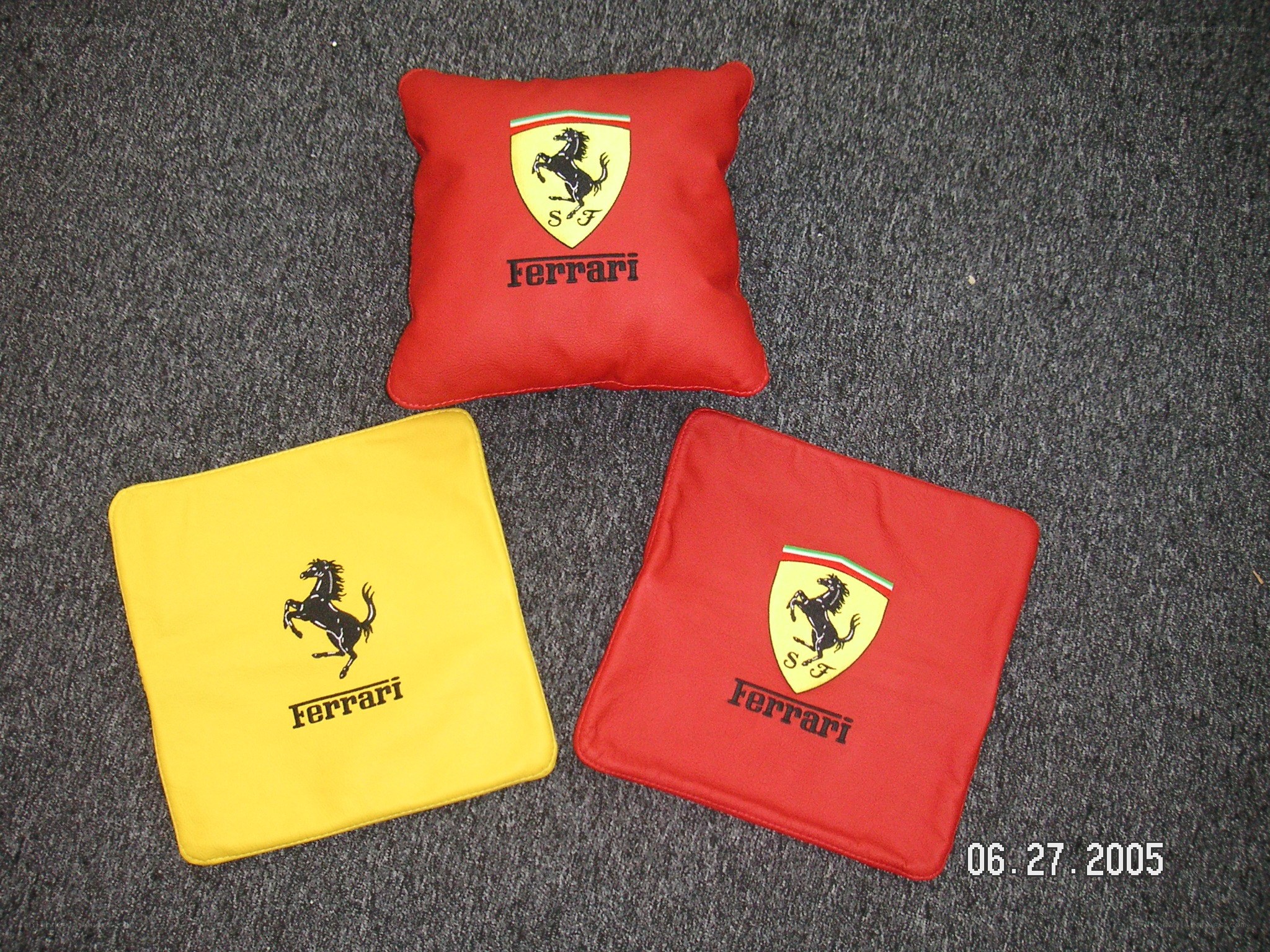 Ferrari-themed pillows on carpet