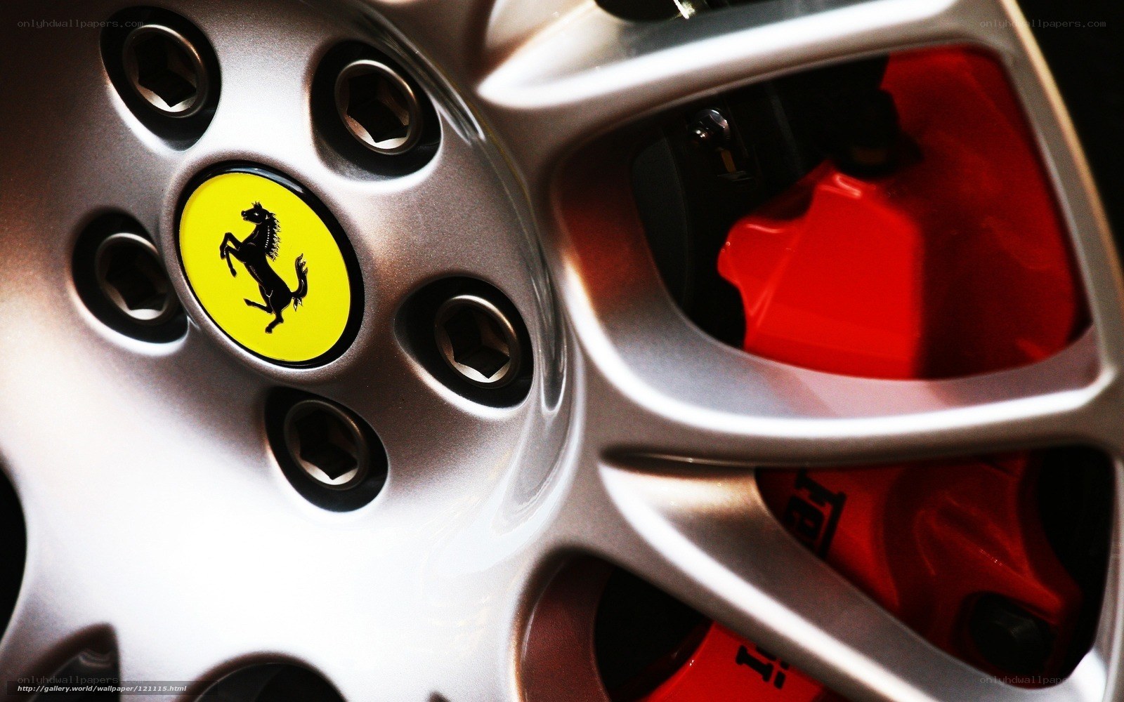Ferrari wheel with red brake calipers