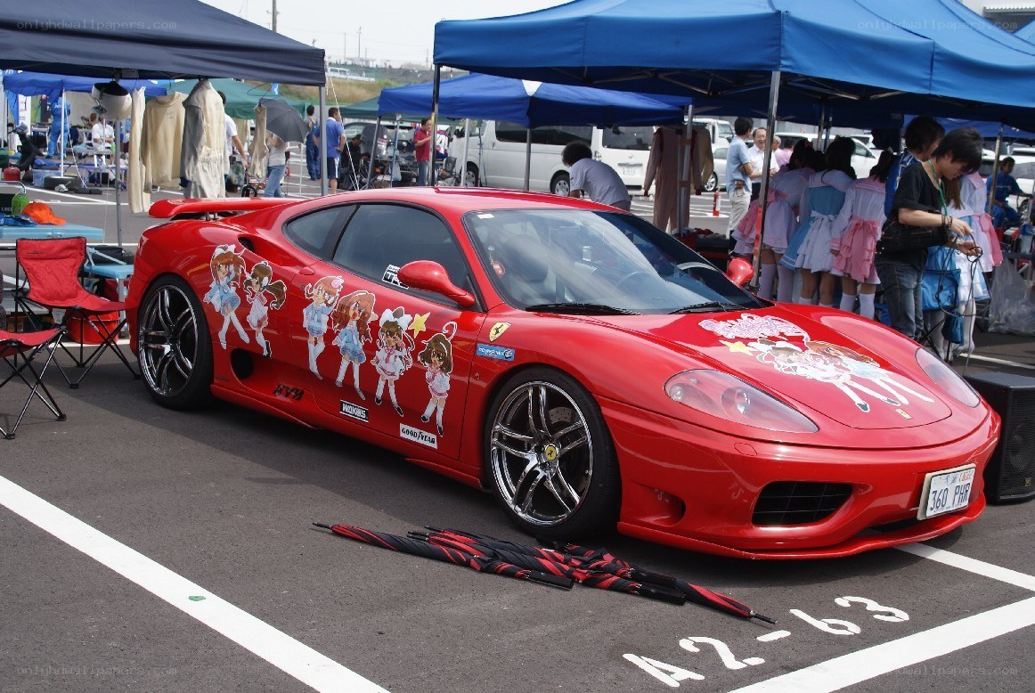 Ferrari with anime decals at event