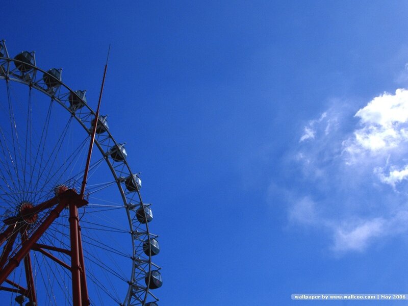 Ferris wheel against blue sky