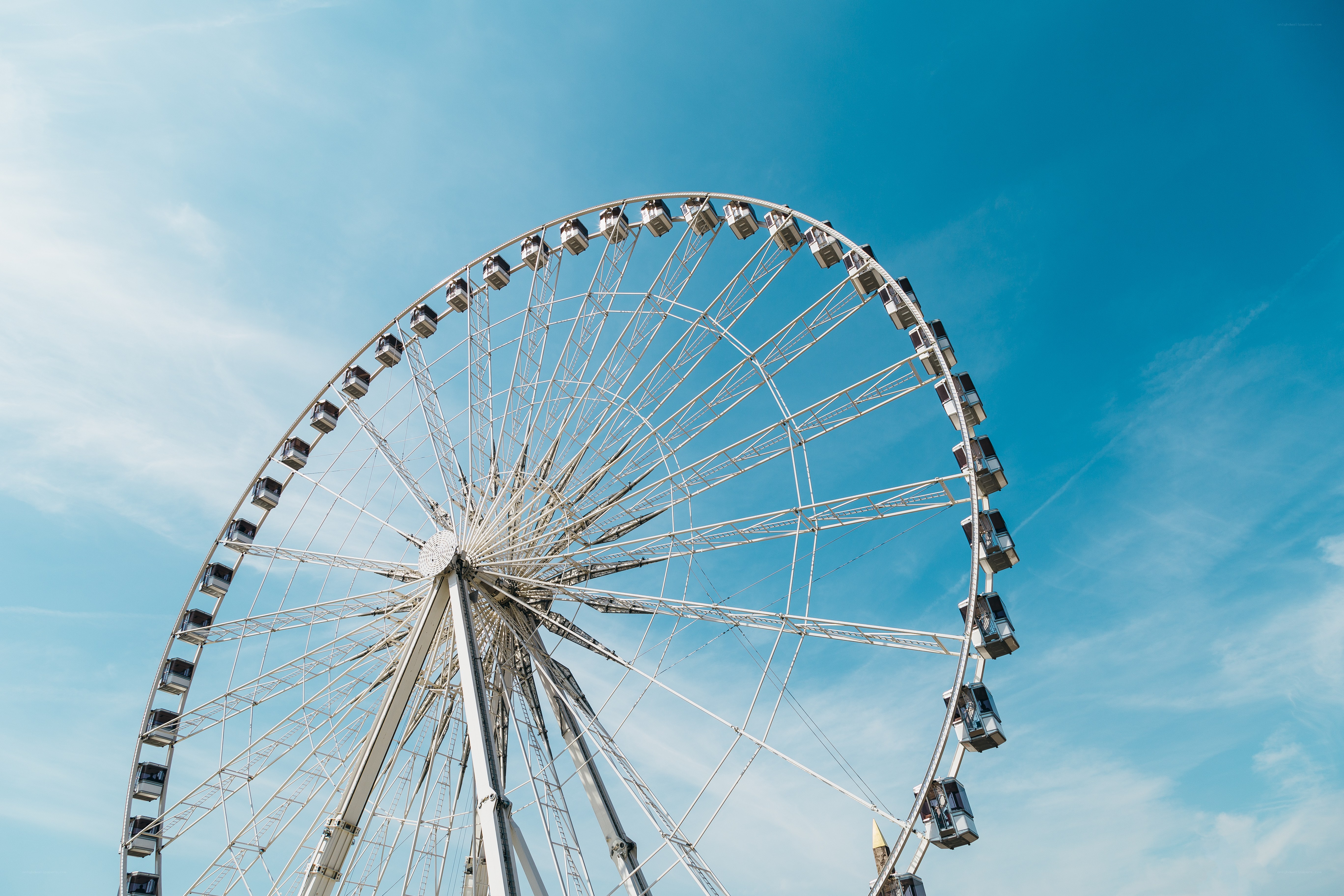 Ferris wheel against blue sky