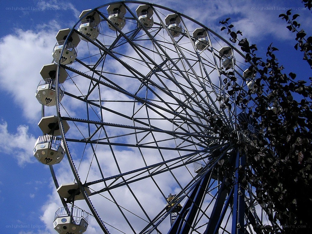 Ferris wheel against blue sky
