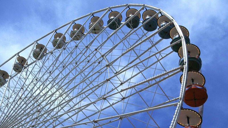 Ferris wheel against blue sky