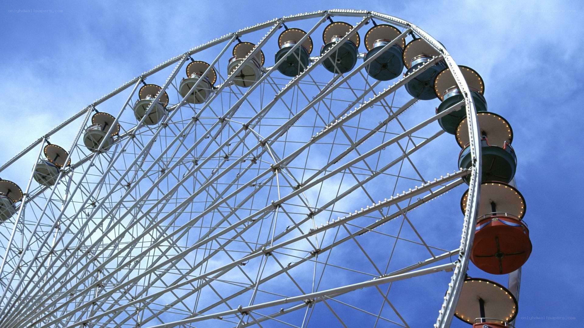 Ferris wheel against blue sky