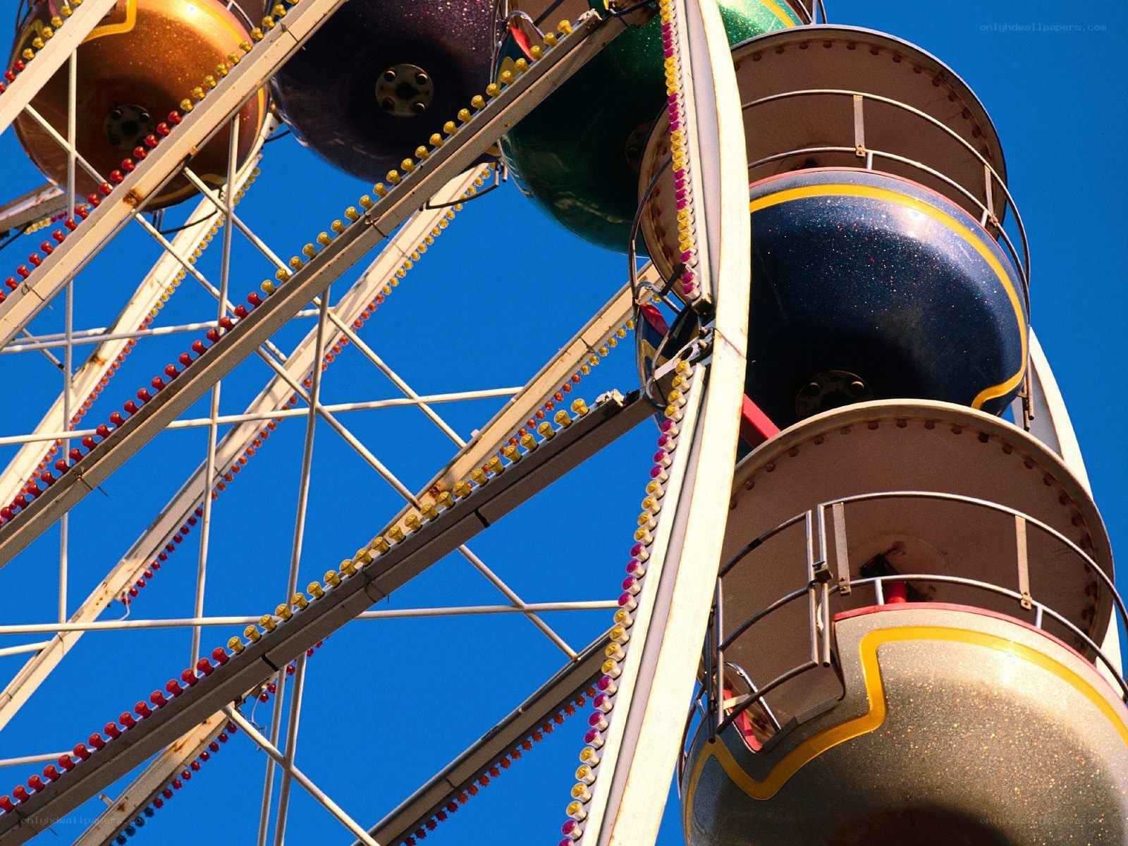 Ferris wheel against blue sky