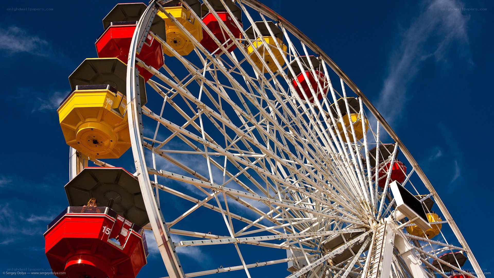 Ferris wheel against blue sky
