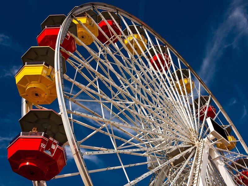 Ferris wheel against blue sky