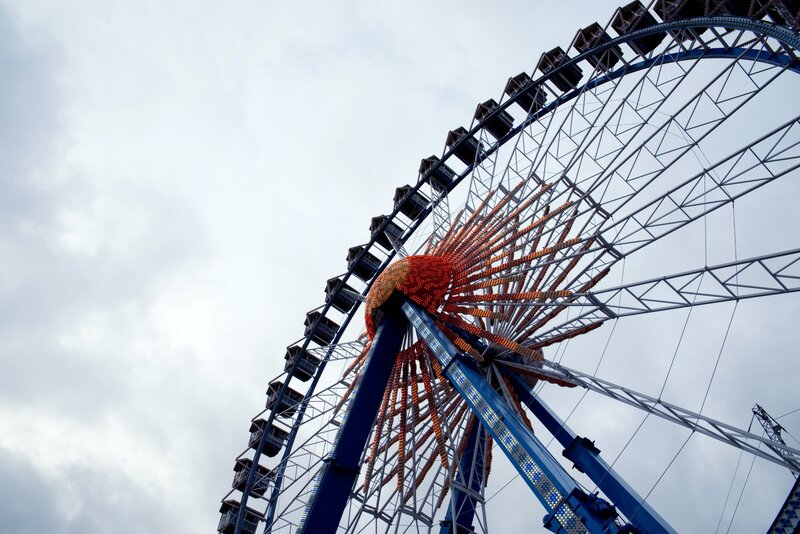 Ferris wheel against cloudy sky