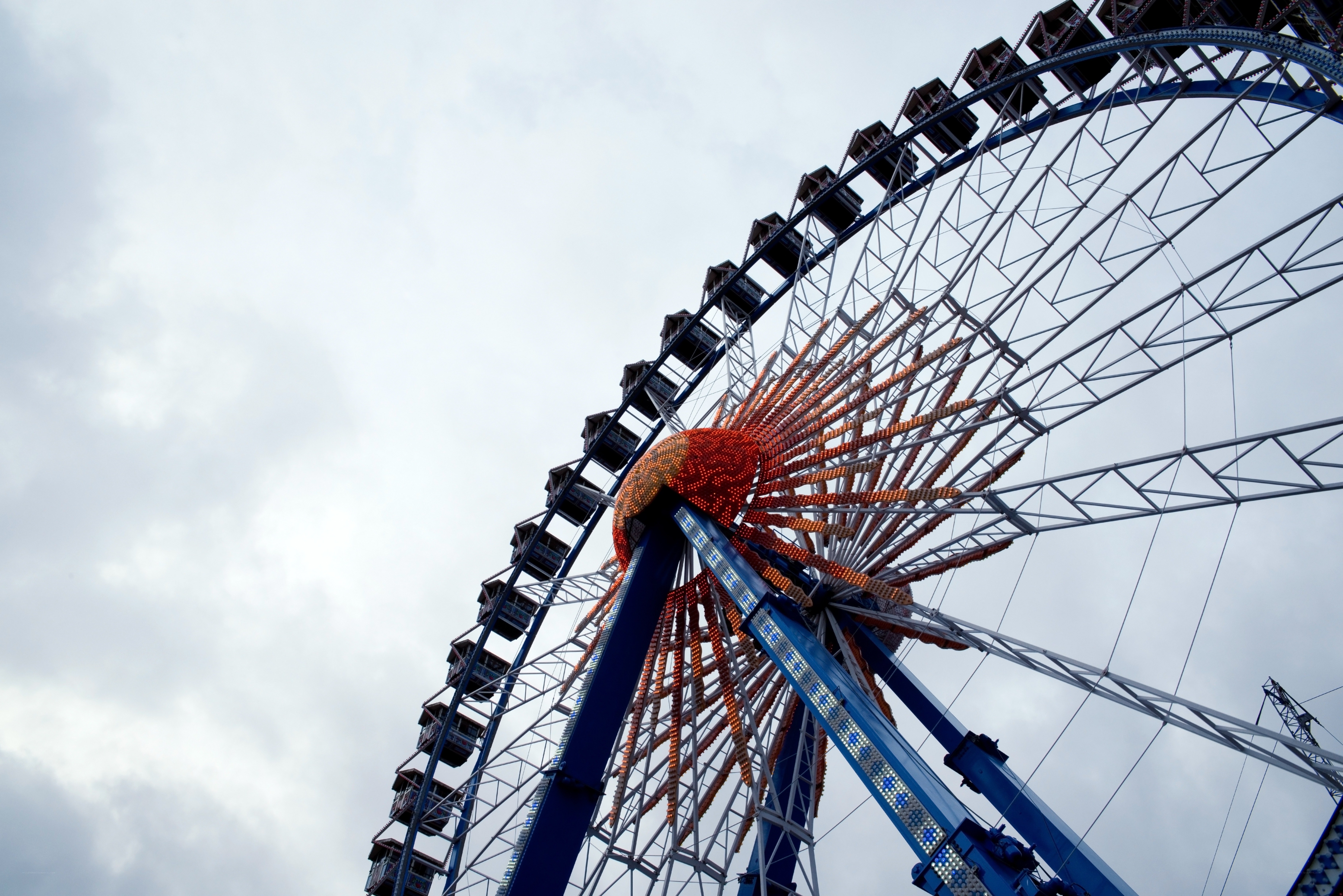 Ferris wheel against cloudy sky