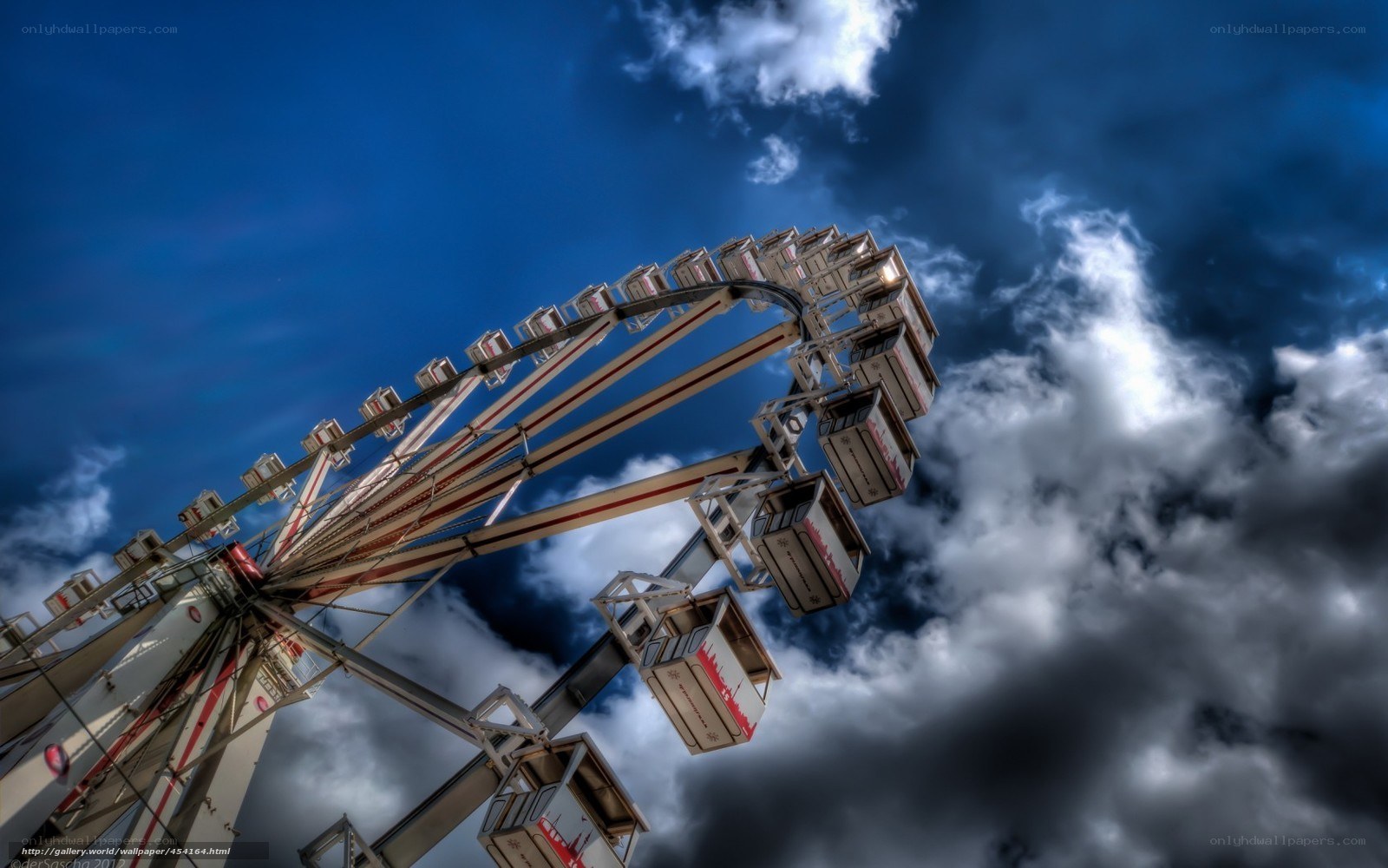 Ferris wheel against stormy sky