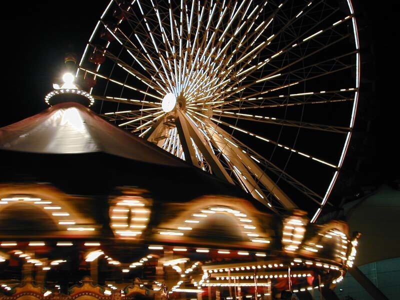Ferris wheel and carousel at night