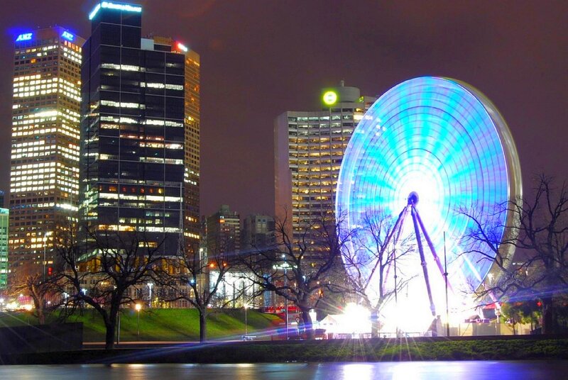 Ferris wheel at night in city
