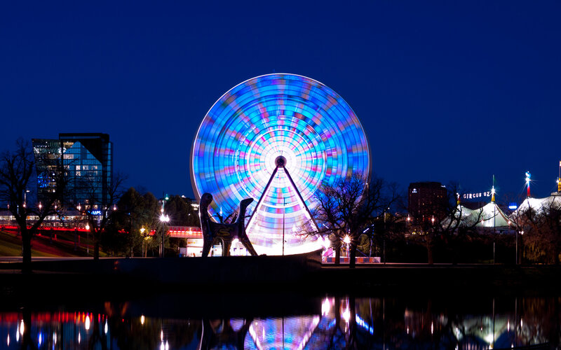 Ferris wheel at night with reflection