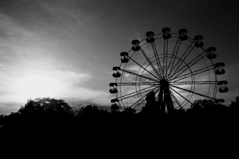 Ferris wheel silhouette at dusk