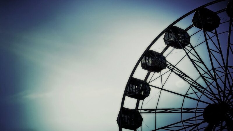 Ferris wheel silhouette at dusk