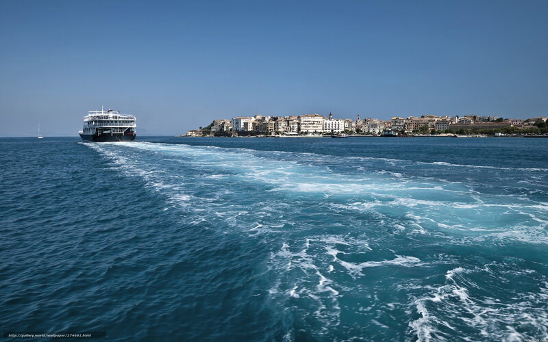 Ferry approaching coastal town