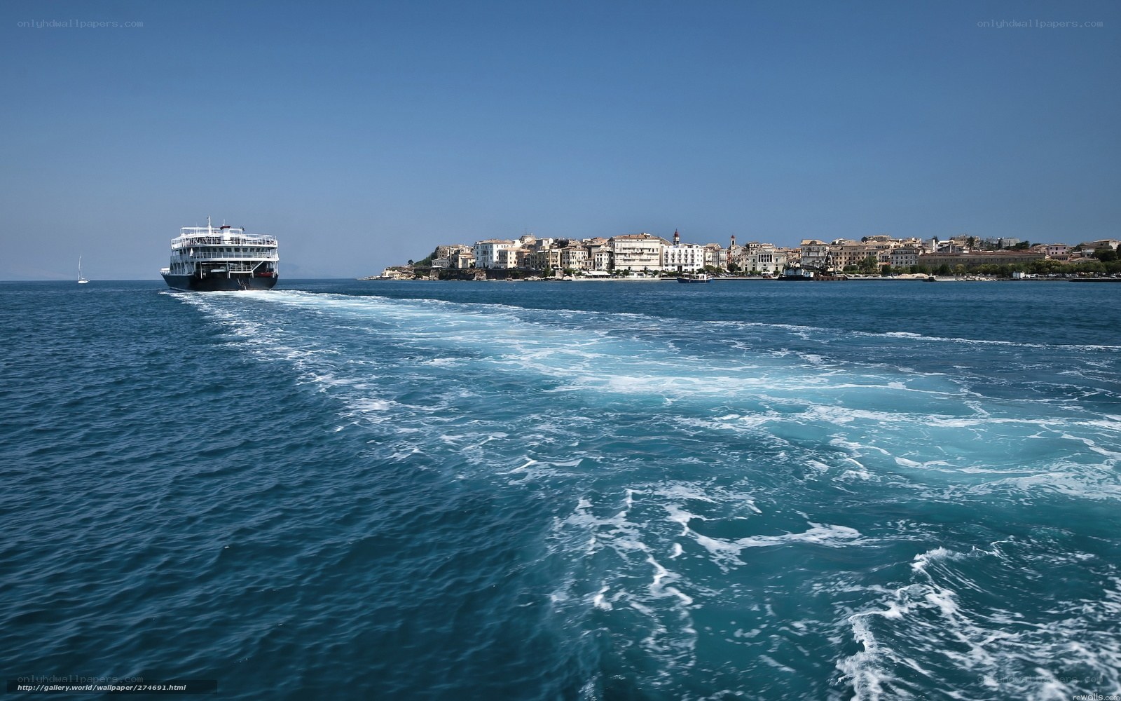 Ferry approaching coastal town