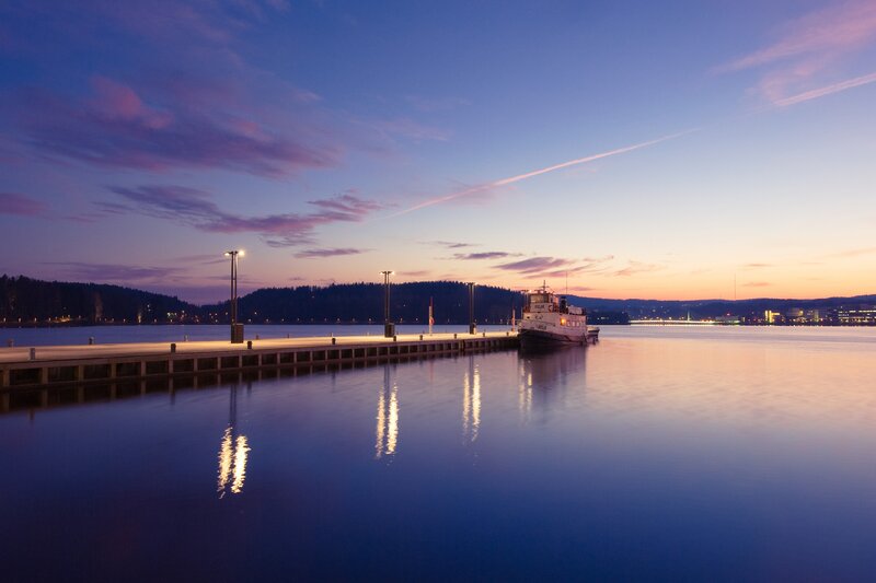 Ferry at a dock during twilight