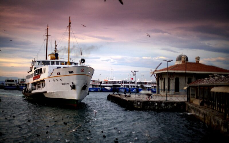Ferry at a harbor during sunset