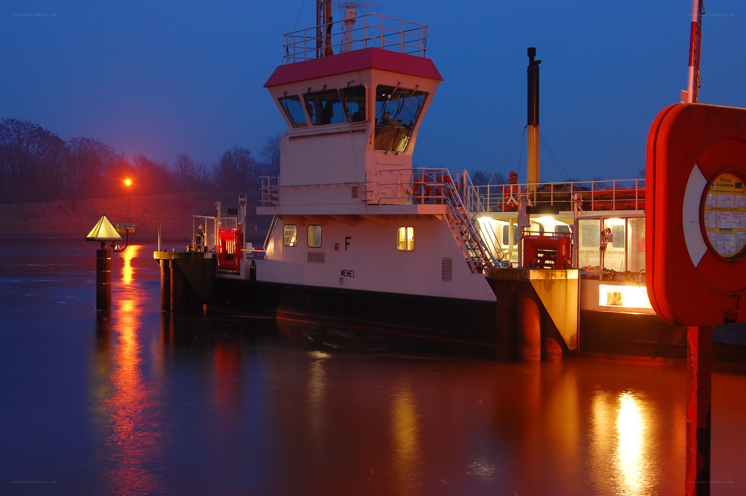 Ferry at dusk on a calm river