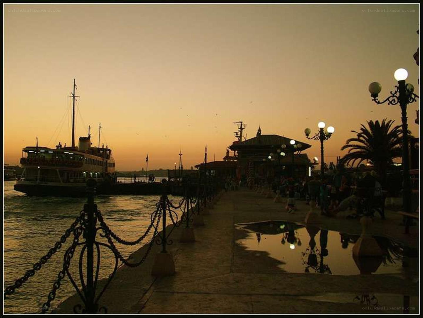 Ferry at sunset by the pier