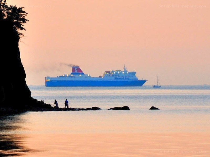 Ferry at sunset on calm water