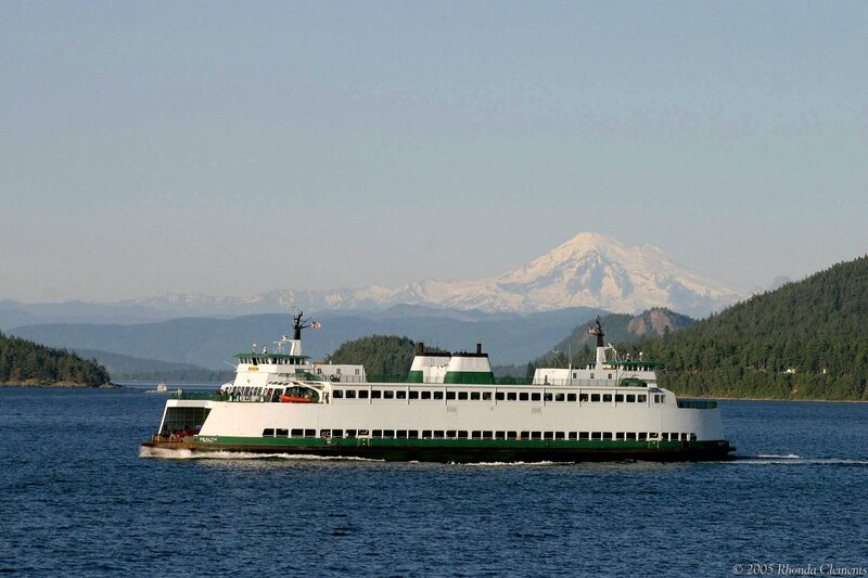 Ferry boat on a lake with mountain