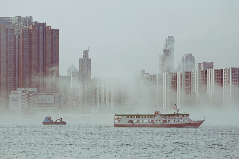 Ferry in a foggy city harbor