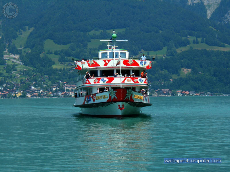 Ferry on a lake with mountains