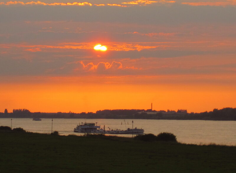 Ferry on River at Sunset