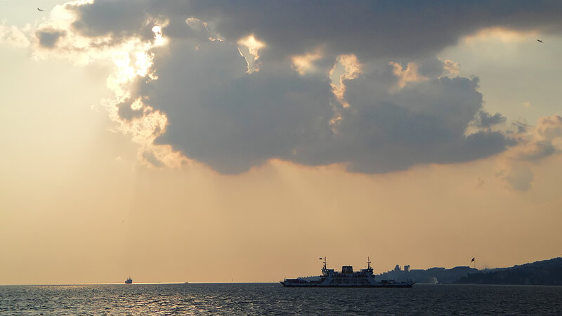 Ferry on Sea at Sunset