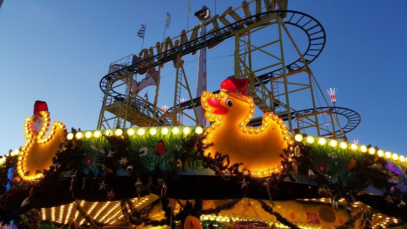 Festive amusement park at dusk