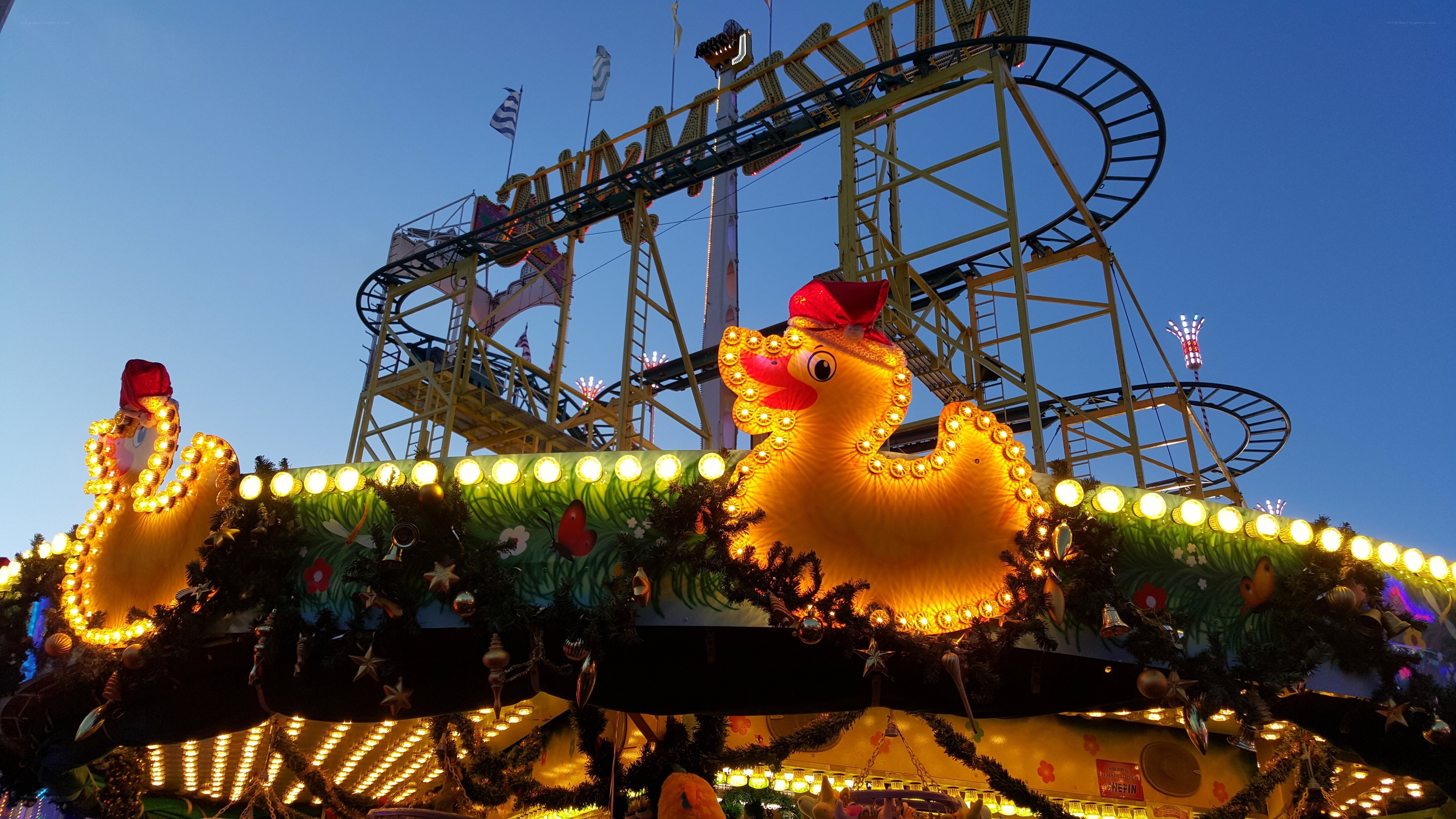 Festive amusement park at dusk