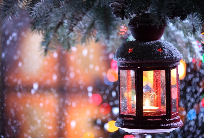 Festive lantern in snowy forest